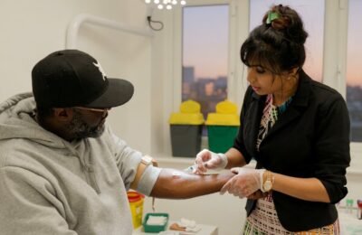 Clinical staff performing a screening test at Clinique Alpa Palmers Green