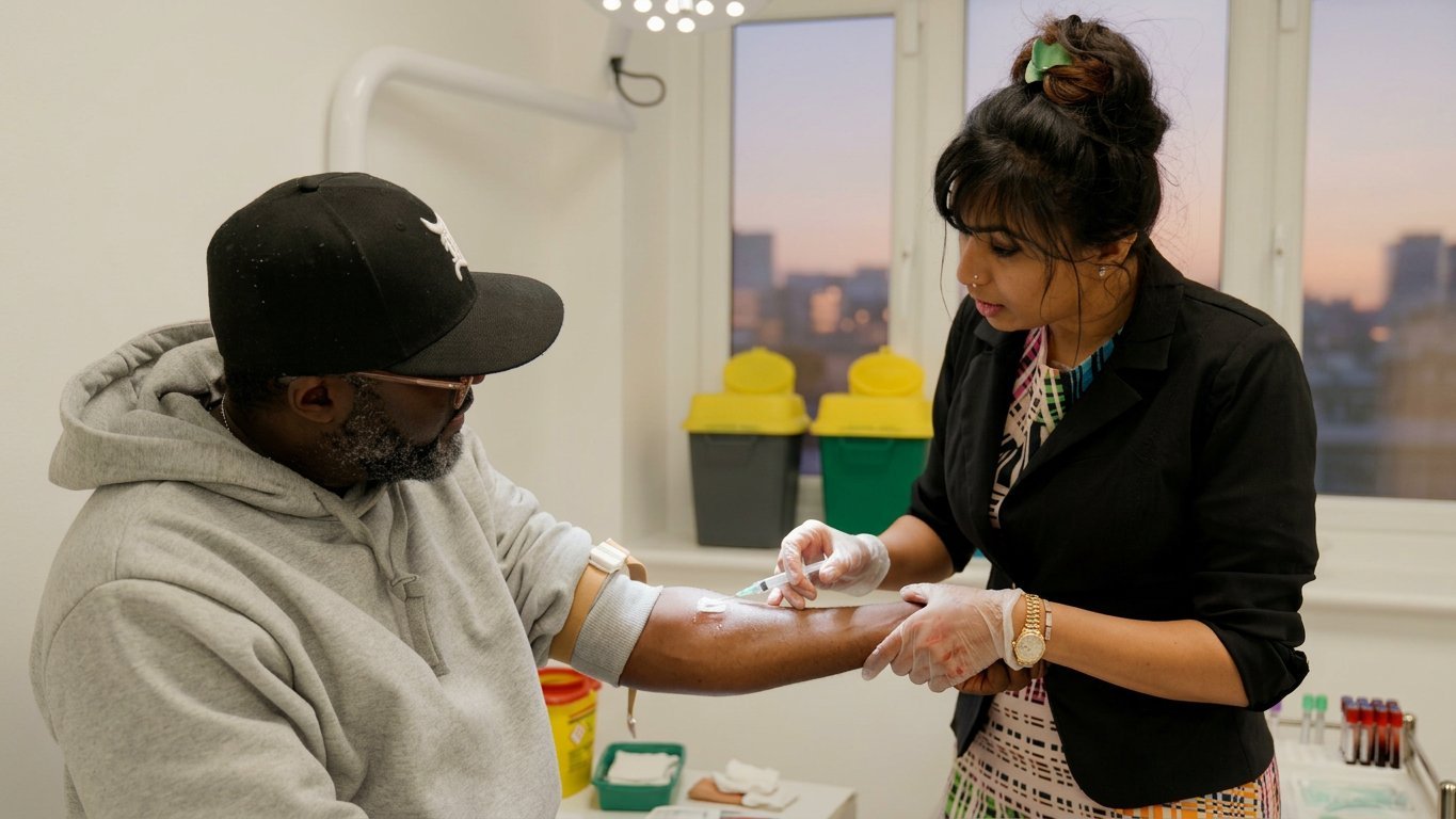 Clinical staff performing a screening test at Clinique Alpa Palmers Green