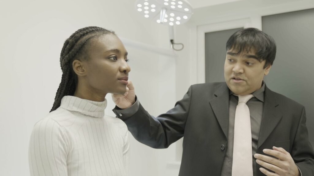 Dr Parmar conducting a health assessment at Clinique Alpa