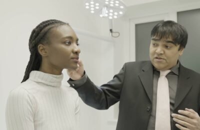 Dr Parmar conducting a health assessment at Clinique Alpa