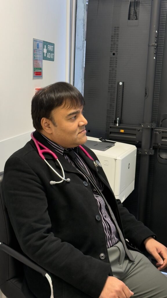 Dr Parmar conducting a thorough patient consultation at Clinique Alpa
