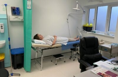 Patient being examined for leg swelling at Clinique Alpa private GP clinic in London